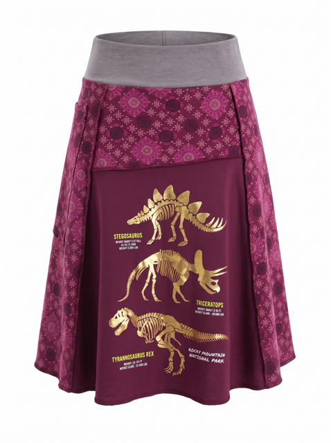 A women's A-line skirt in deep magenta, featuring a patterned upper section, a solid gray elastic waistband, and a large front pocket printed with gold dinosaur skeleton graphics and labels.